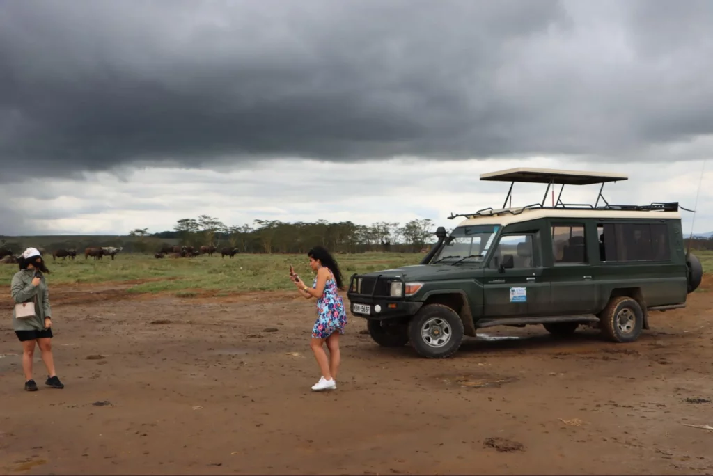 clients taking a photo at Lake Nakuru during a safari